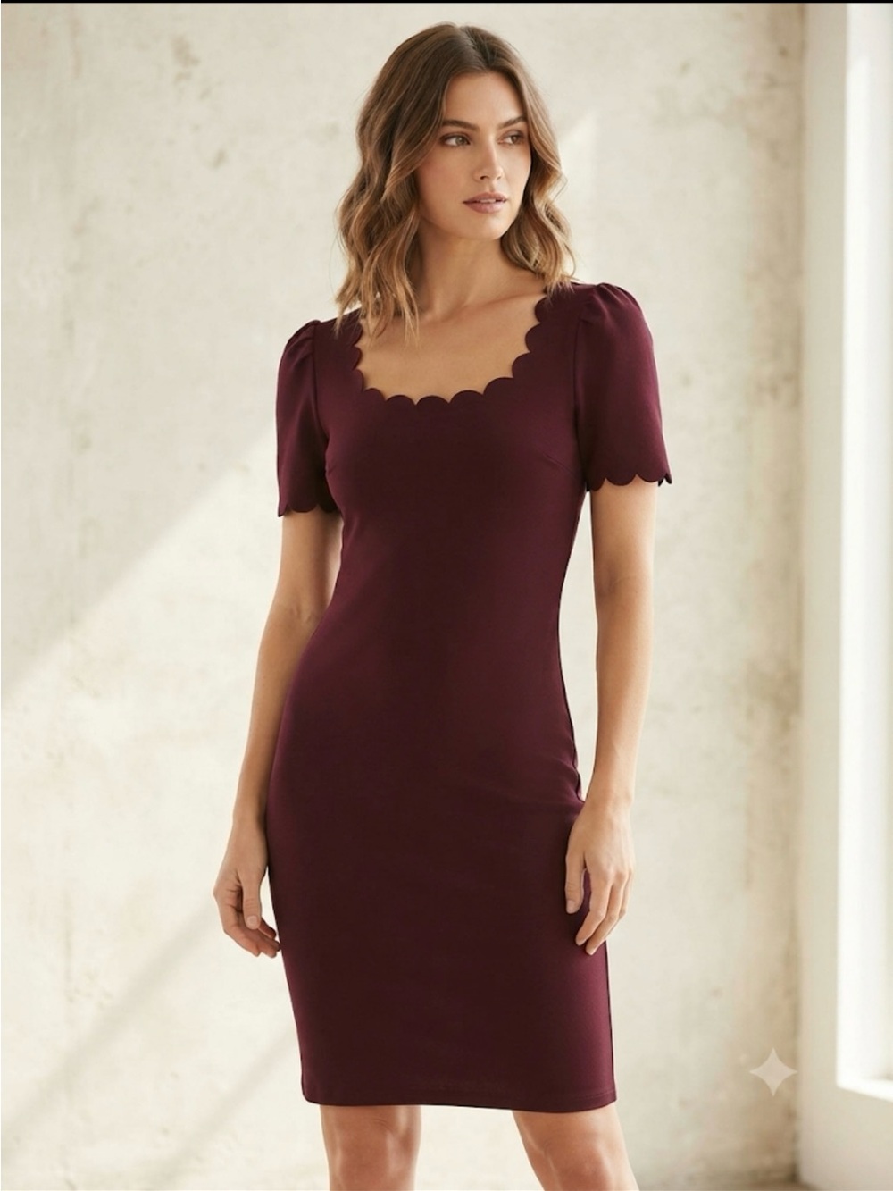 burgundy short-sleeve bodycon dress with a scalloped neckline and sleeve